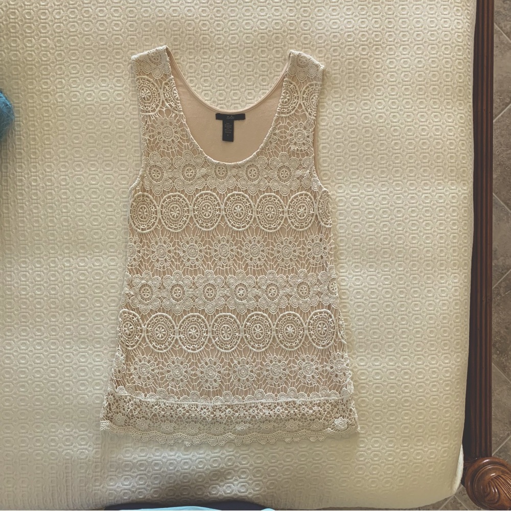 Rain ladies lined sleeveless top. Super soft self fabric lined with back fabric.